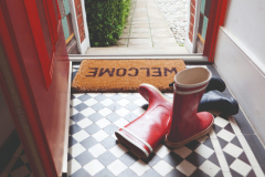Welcome mat and wellington boots